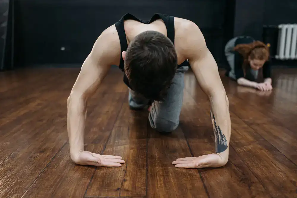 Beginner students warming up their arms in the studio