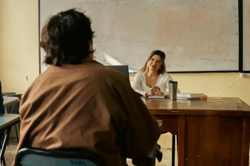 A flamenco teacher leading a class with passion